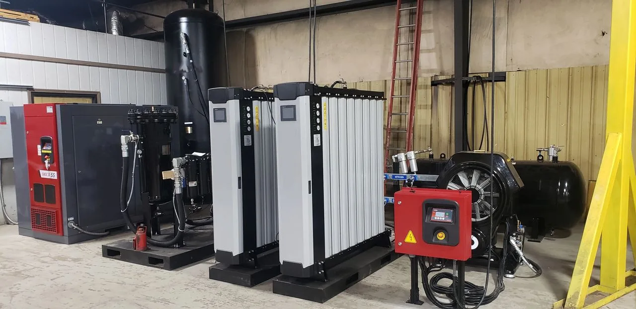 Compressed air and nitrogen tank system set up within a building